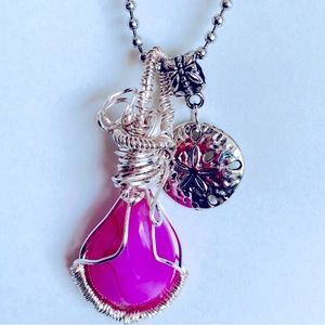 Natural pink striped agate wirewrapped pendant necklace with sand dollar charm